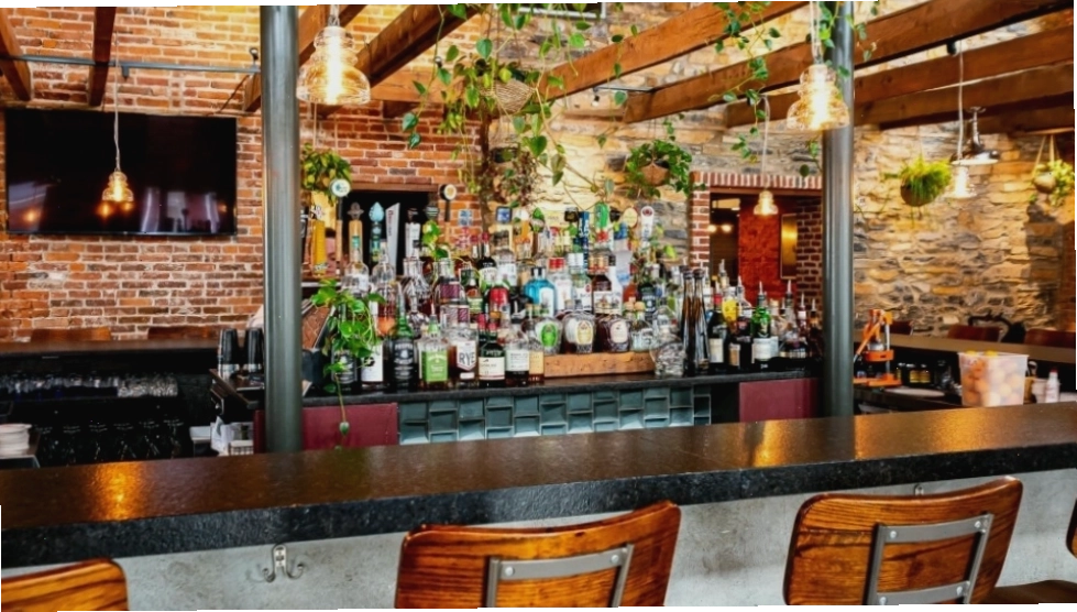 The exterior of Rising Sun Bar & Kitchen, a historic establishment with a modern vibe